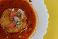 Kat vada, Kat wada or Batata vada sambar or Vada usal, spicy and tasty snack,ÃÂ vada or potato patties served in curry